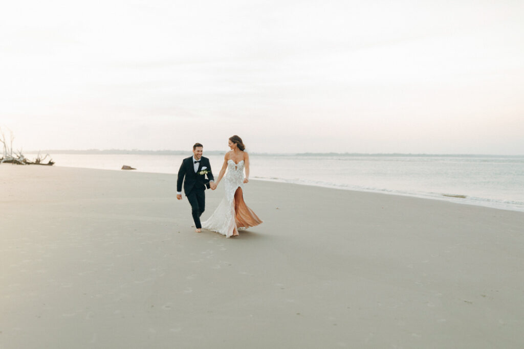 One of the best things to do when you elope is to plan an adventure - like this couple running on the beach.